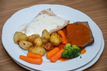 Pork steak with carrots and broccoli