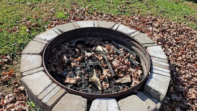 Panning around view of outdoor stone fire pit