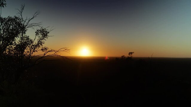 A sunrise over the mallee scrub country in the Australian outback.
