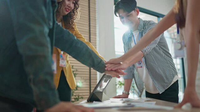 seccessful business meeting group of young smart attractive business team work hand together cheering up for their new project successful result in meeting room business success ideas concept 