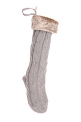 Christmas knitted sock hanging on white background