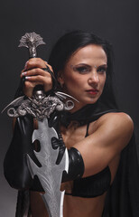 Portrait fantasy woman warrior in armor with sword