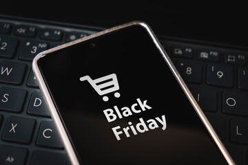 black friday sale. special offer discount text on mobile phone screen message. Get a promotional code for discounted purchases during the sale. Buying through the Internet. The concept of ecommerce.