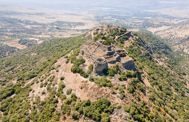 Obraz premium Drone view of the remains of the all medieval fortress of Nimrod - Qalaat al-Subeiba, located near the border with Syria and Lebanon on the Golan Heights, in northern Israel