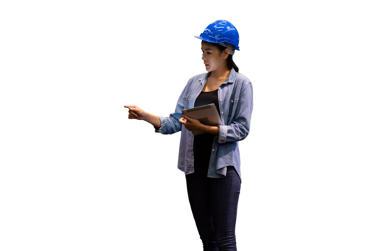 Portrait of female worker wearing safety uniform, helmet standing and working with digital tablet on white background