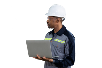 Portrait of male engineer wear uniform and helmet standing and working laptop computer on white background
