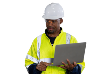 Portrait of male engineer wear uniform and helmet standing and working laptop computer on white background