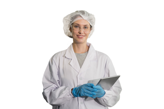 Portrait of female medical scientist wearing uniform, hairnet, gloves and holding digital tablet on white background