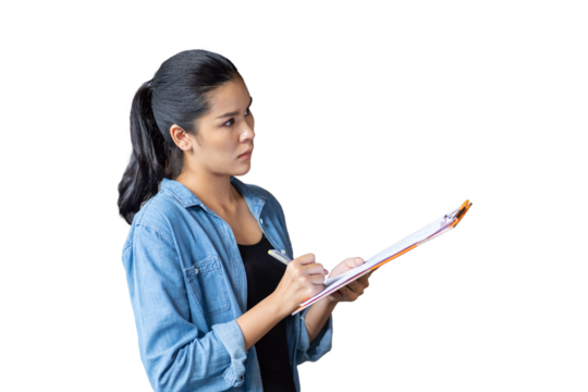 Portrait of female worker wearing safety uniform standing and working with clipboard on white background