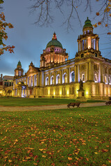 The illuminated Belfast City Hall at dawn in autumn