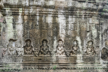 Bas relief depicting sages on a panel inside the Preah Khan templex complex at Siem Reap, Cambodia,...