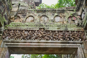 Lintel carving with bas relief of gods from Hindu and buddhist mythology at Siem Reap, Cambodia,...