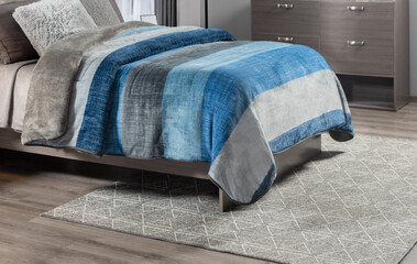 Modern Bedroom Detail: Luxurious Grey Velvet Throw atop a Striking Blue and Grey Linen Duvet Cover,...