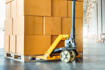 Package Boxes Stack on Pallet and Hand Pallet Truck. Cartons, Cardboard Boxes. Storehouse, Distribution, Supply Chain. Supplies Warehouse Shipping.	
