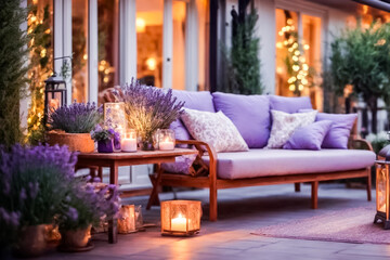 A beautiful veranda at dusk, illuminated by lanterns and candles, with bouquets of lavender and comfortable furniture for relaxing. Cozy relaxing area at home