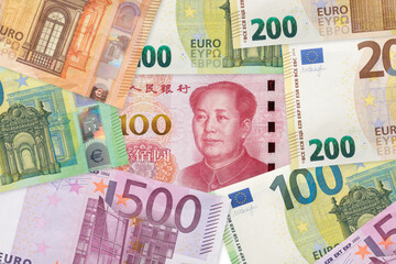 Chinese yuan and Euros banknotes. EU and China trade war