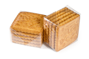 Two packs of biscuits in a transparent package. Biscuits on a white background.