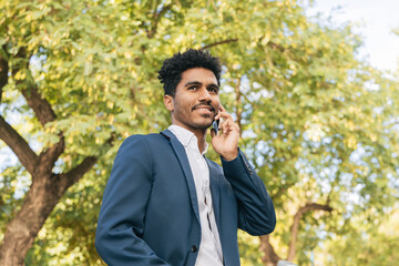 Ethnic man speaking on mobile phone