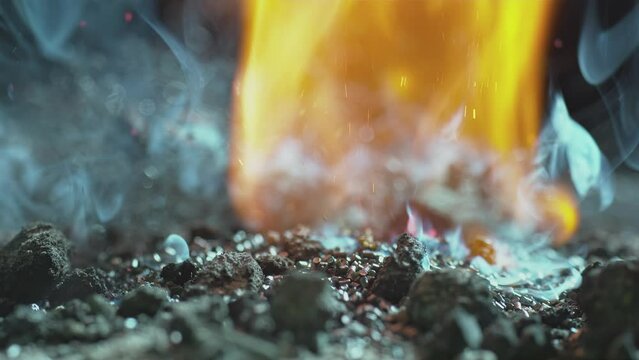 Smoke Rises From Hot Embers And Then They Burst In To Flames