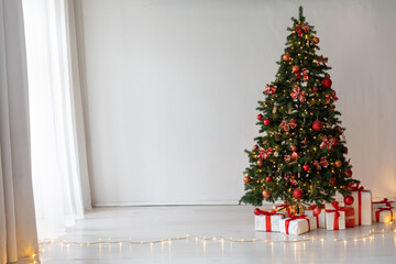 christmas tree with gifts and toys decorated with christmas garland