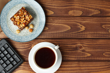 Fototapeta premium Brownie cake with chocolate and hazelnuts on plate
