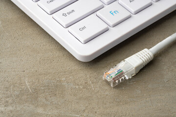 Computer keyboard with network cable close up