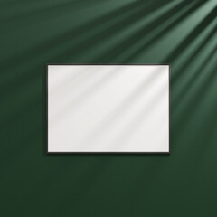 Naklejka premium Hanging frame mockup on dark green wall