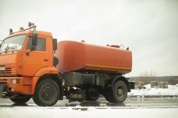 Truck with a cesser. Transportation of water. Large tank on the truck.