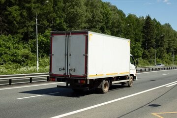 Freight transport on road. Car is driving on highway. Freightage. They were highway.