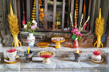 Prayer offerings to the main Buddha diety at Angkor Wat temple at Siem Reap, Cambodia, Asia