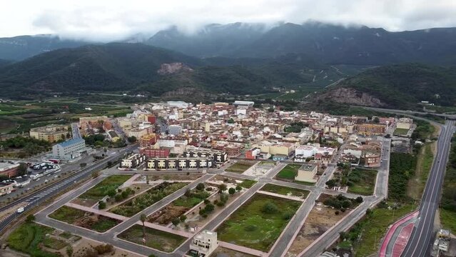 Drone images of Favara, a Spanish town in the province of Valencia surrounded by a mountain range called La Murta and La Casella covered by clouds