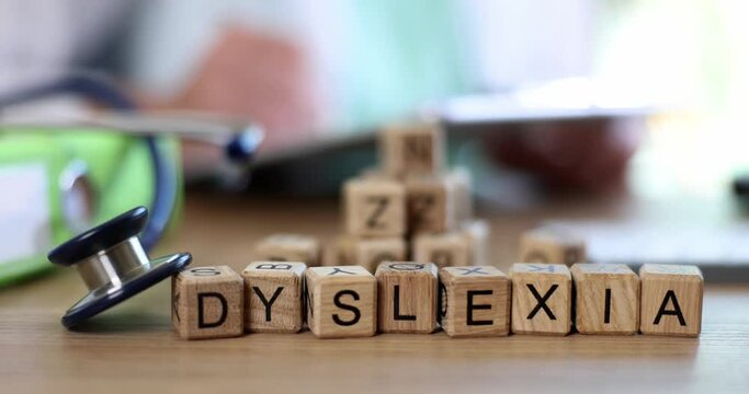 Medical stethoscope text on dyslexia cubes. Medical dyslexia causes, symptoms, diagnosis and treatment of adults and children