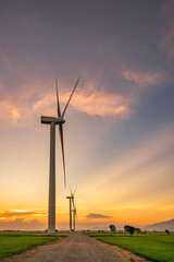 Obraz premium Panoramic view of wind farm or wind park, with high wind turbines for generation electricity with copy space. Green energy concept. Ninh Thuan, Vietnam
