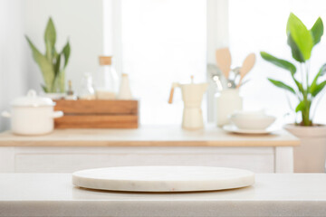 Fototapeta na wymiar Round pedestal with free space for your decoration on blurred kitchen interior background