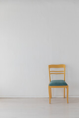 one vintage empty chair in white room interior