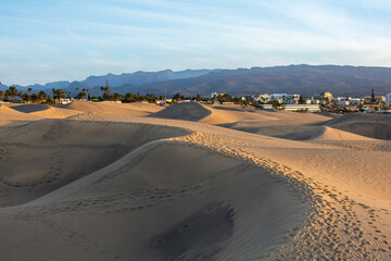 Sand dunes of Maspalomas with a view of the city on Gran Canaria, Spain