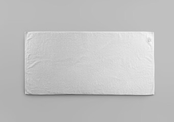 Mockup of white terry towel with label isolated on background.