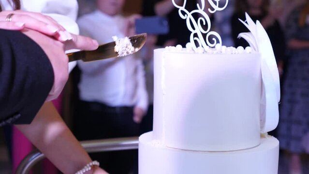 Wedding cake with the initials of the newlyweds. Wedding traditions.