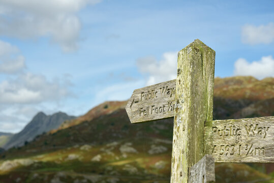 Wooden signpost in the valley of Little Langdale in the Lake District