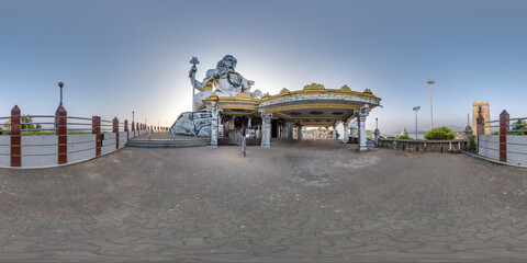 full 360 hdri panorama near tallest hindu shiva statue in india on mountain near ocean in...