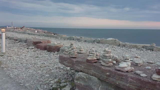 Panorama of the embankment with stone figures stacked on it Byxelkrok, Sweden