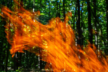 Flame of charcoal fire. Hearth for cooking and heating. Danger in forest