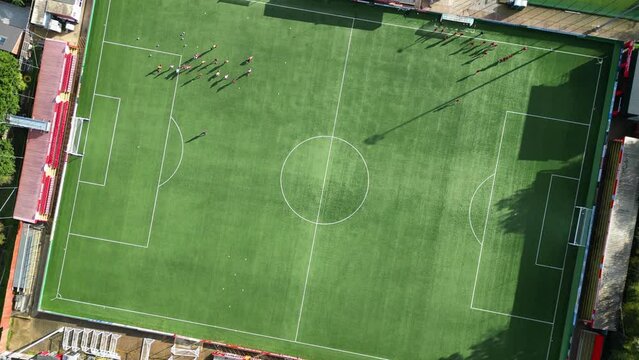 High Angle Footage of Football Playground at Hemel Hempstead City of England UK. The Footage Captured with Drone's Camera on November 5th, 2023 During Bright Sunny and Windy Day.