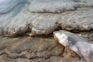 Unique landscape of the white salt stone at the salt beach in the dead sea area