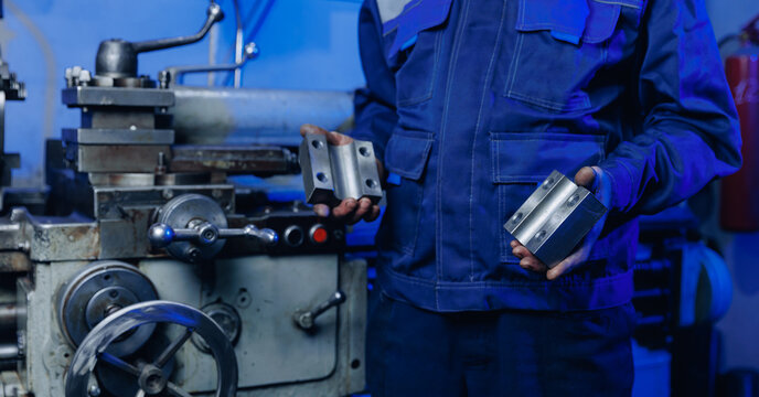 Mechanic worker use milling machine for manufacturing detail of truck. Concept factories for parts, fix workshops in garage