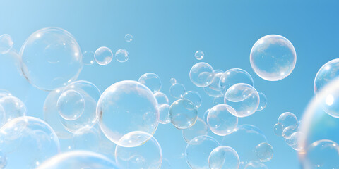 Transparent abstract soap bubbles on blue background 