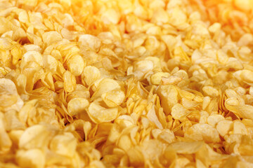 Fresh Crispy potato chips snack texture background, top view