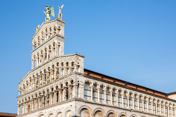 Closeup of San Michele in Foro, a Roman Catholic basilica located in Lucca, Tuscany, Italy. The church is built in Romanesque style and is located in the historic center of the city.