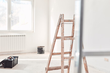 Ladders and tools on a construction site.