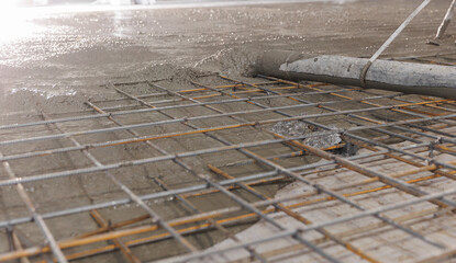 Concrete concreting floors of buildings in construction site. Concept pouring cement to base plate